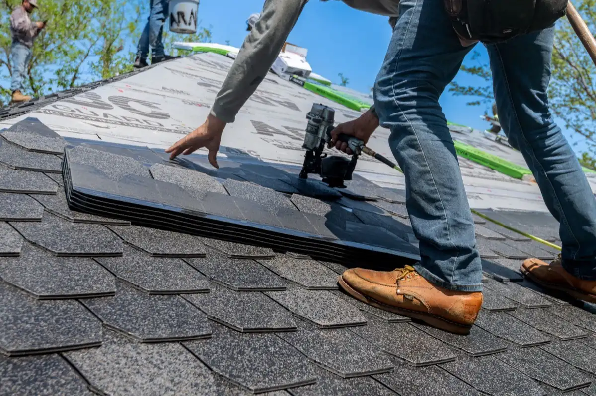 Inspecting an asphalt shingle slope after a hailstorm in El Monte, CA