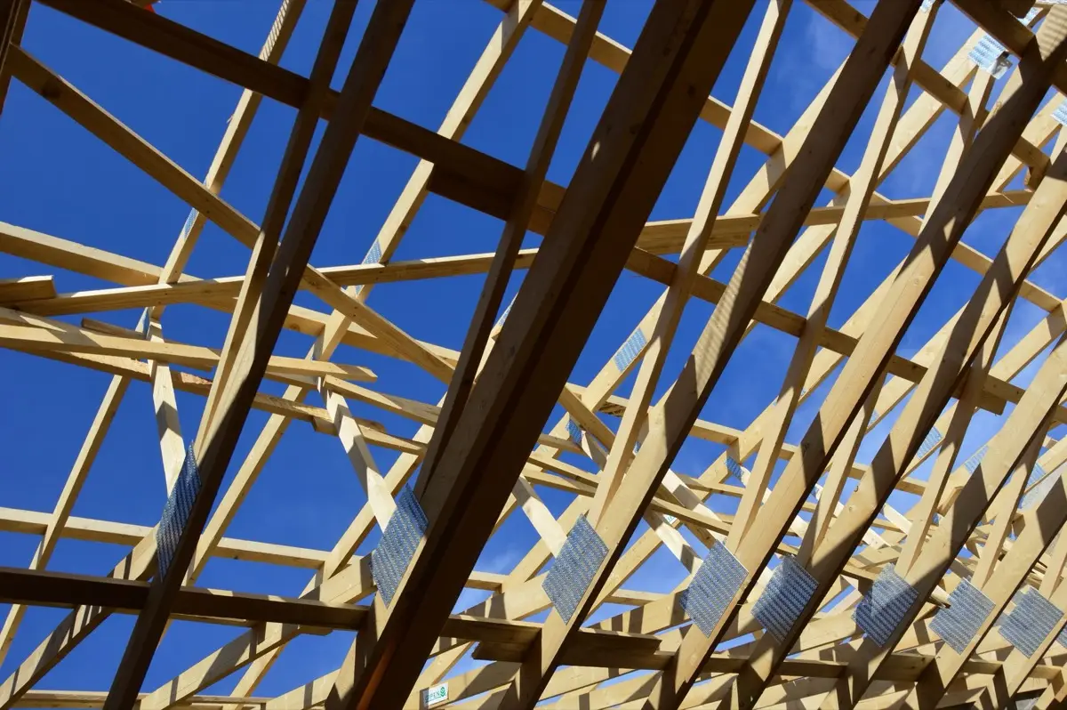 Bare rafters and panel decking on a house in El Monte, CA before the covering goes back on